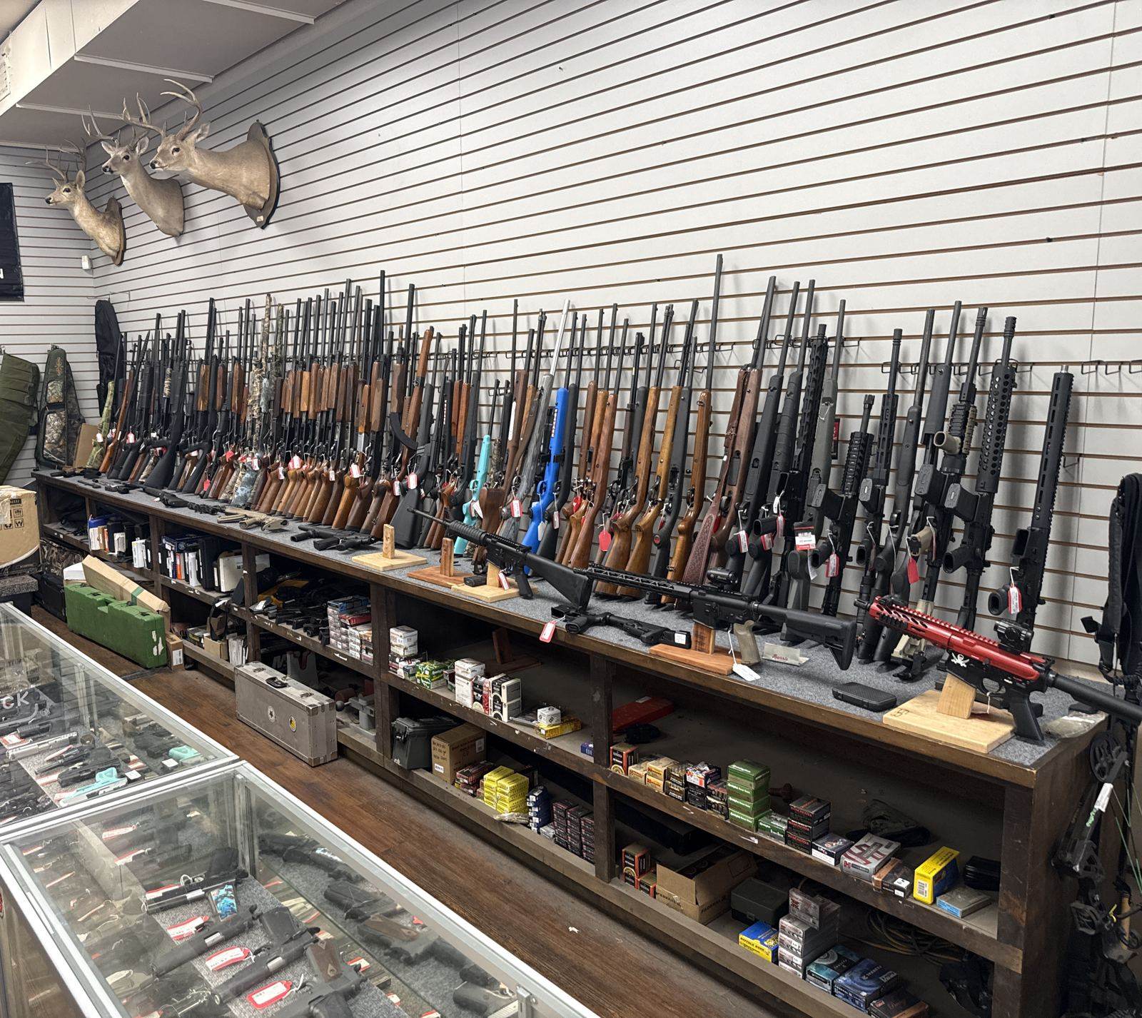 Pawn Max firearms wall with rifles, shotguns and ammunition